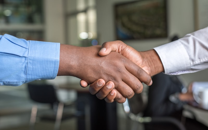 Two business partners shaking hands